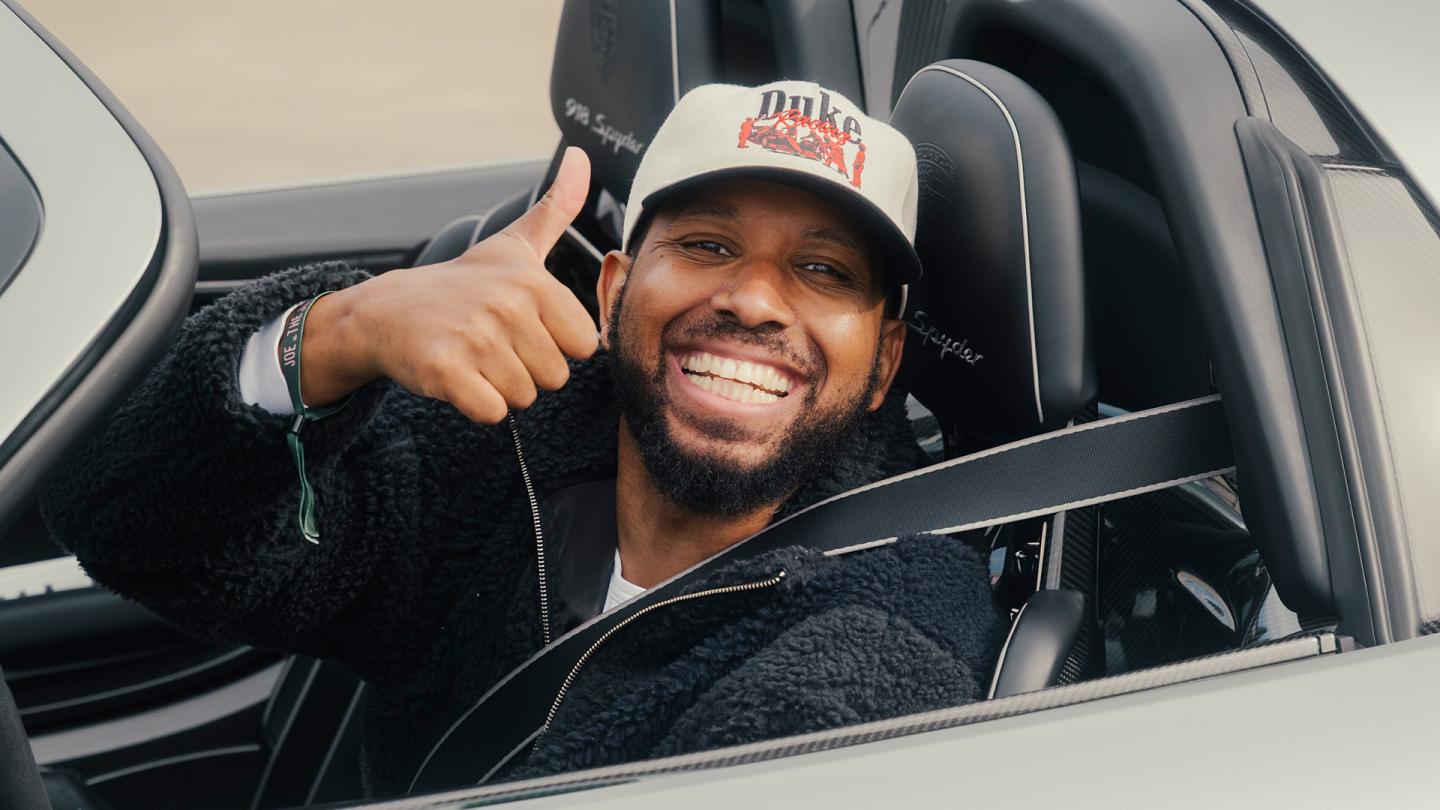 Person giving thumbs up sitting in a Bentley