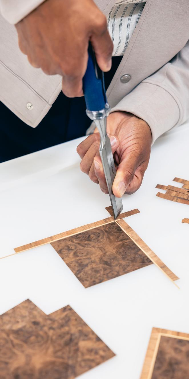 Artisan at work creating bespoke veneer